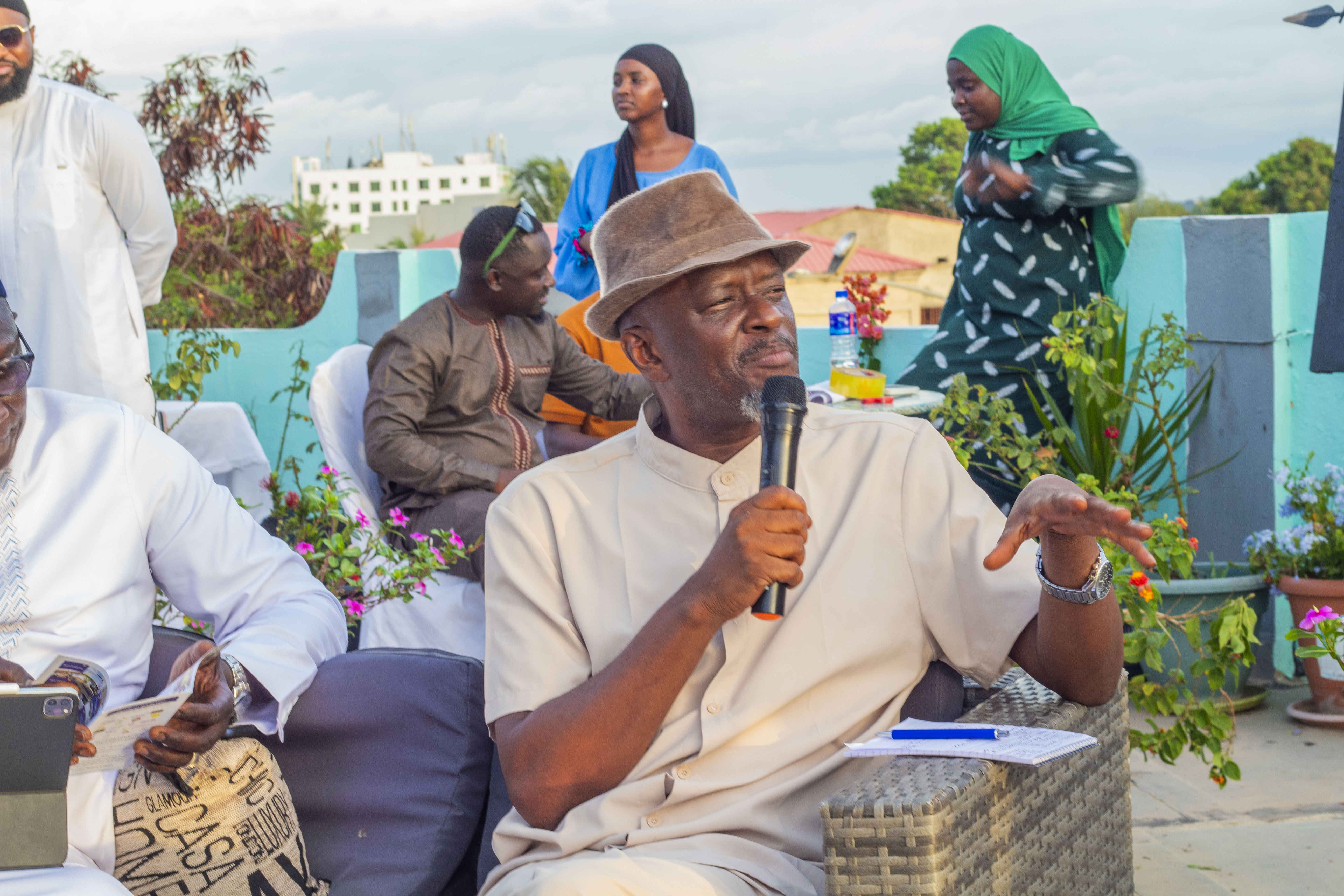 Man speaking at an event, representing MSME growth acceleration